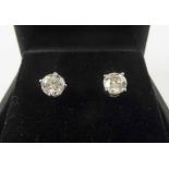 14K WHITE GOLD DIAMOND STUD EARRINGS, a pair, total 1.5cts.