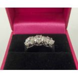 18K WHITE GOLD RING, set with three substantial diamonds, total 2.91cts, size 'M'.