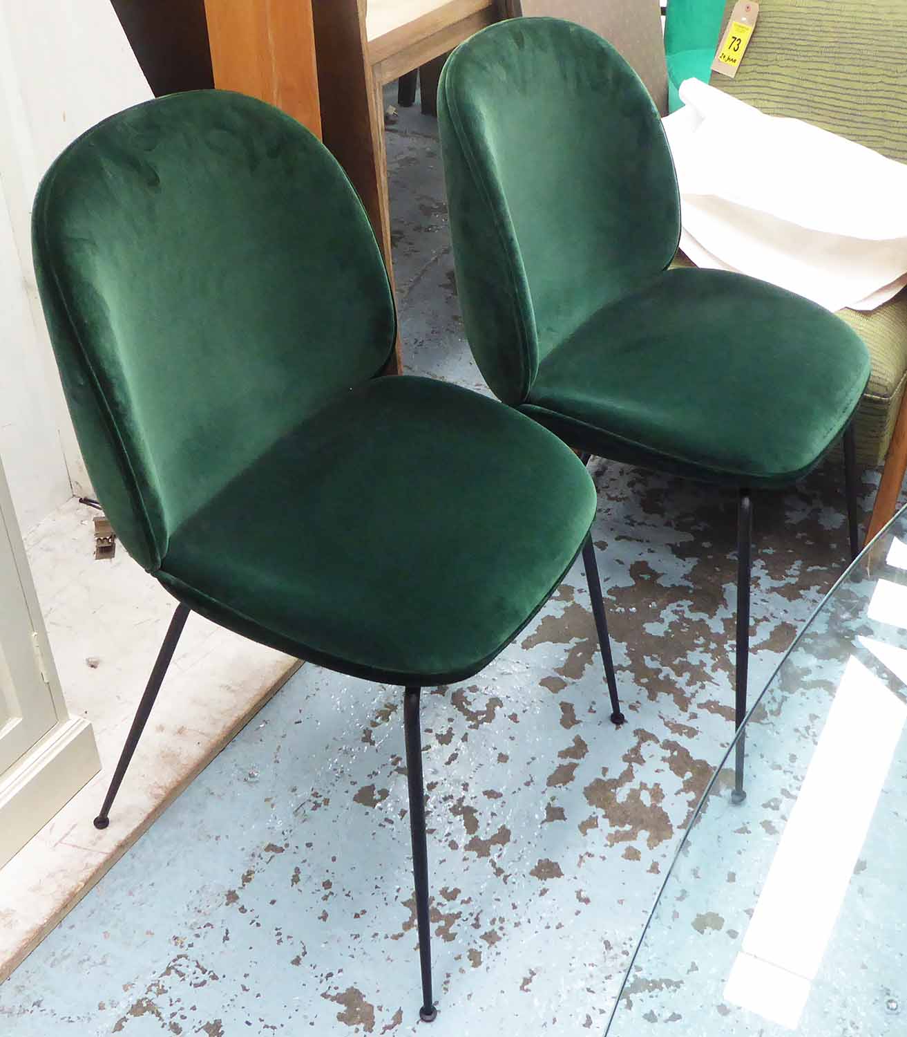 DINING CHAIRS, a set of ten, green velvet upholstered on black metal frames.