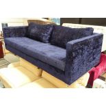 SOFA, from Designers Guild, in midnight blue upholstery, on tubular supports,