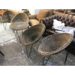 GARDEN SUITE, woven cane on black metal bases, comprising four chairs and a low table.