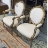 FAUTEUILS, a pair, Louis XVI style, in calico on gilded carved frames, 69cm W.