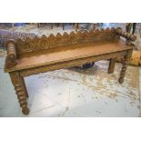HALL BENCH, Victorian Gothic oak, rectangular with raised bolster handles, curved back,