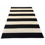 MADELINE WEINRIB CARPET, 266cm x 185cm, black and white striped design.