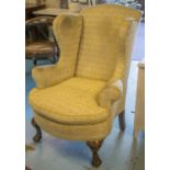 WING ARMCHAIR, Georgian style in yellow fabric, with cabriole supports, claw and ball feet,