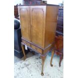 COCKTAIL CABINET, Queen Anne style burr walnut with two doors above two drawers,