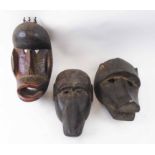 WEST AFRICAN MONKEY FACE MASKS, three various, carved wood, largest 35cm H x 18cm.