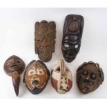 TRIBAL FACE MASKS, a collection of six, various West African,
