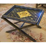 TRAY TABLE, ebonised and gilt boss decorated of galleried rectangular form, on folding stand,