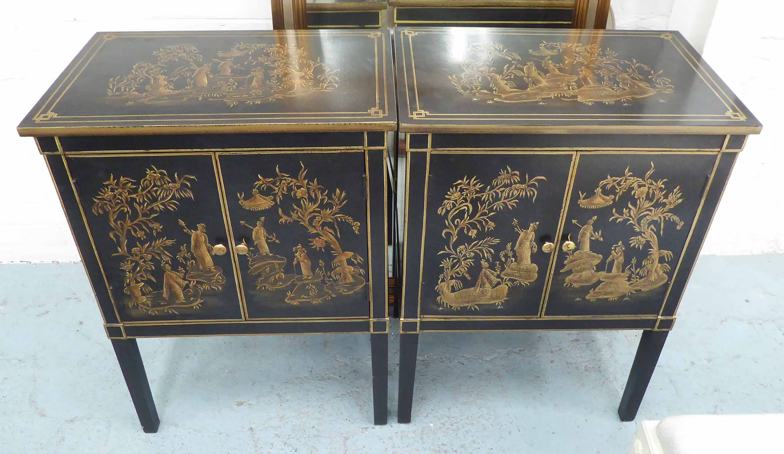 SIDE CABINETS, a pair, Chinoiserie style, in black with stylised gilt figural decoration,