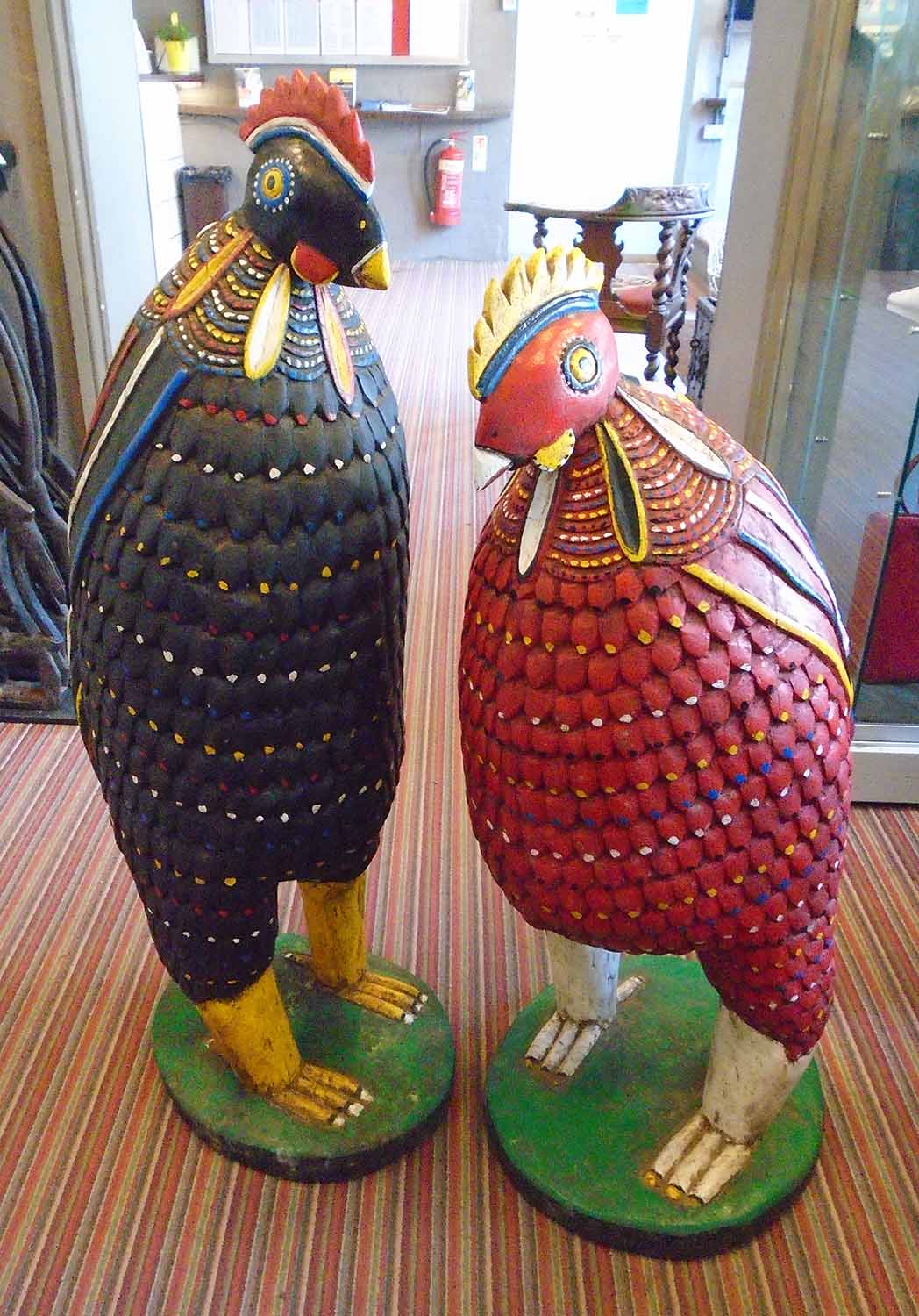 TWO LARGE CHICKENS, West African, carved and painted wood, 112cm H x 102cm H.