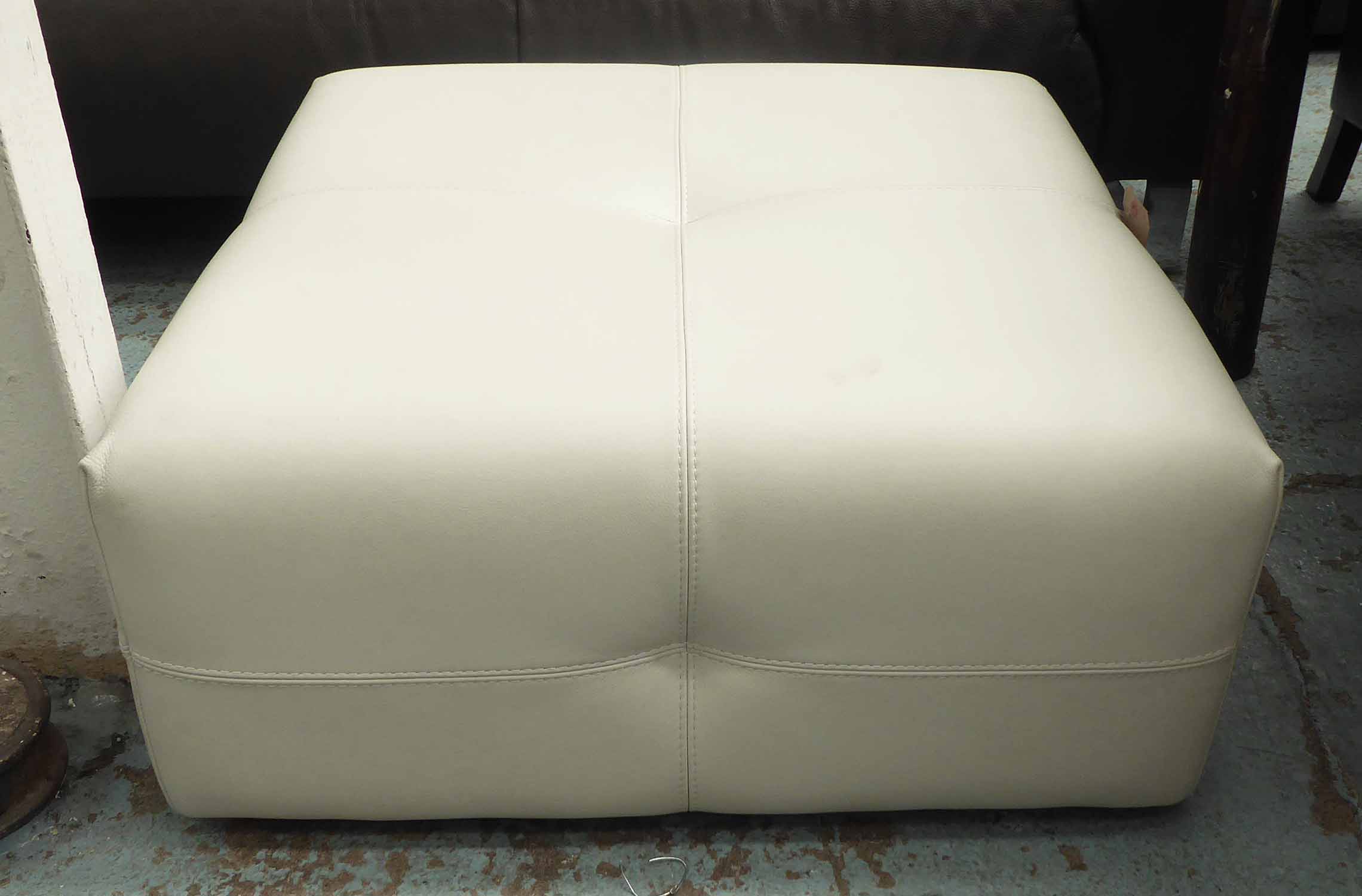 NATUZZI FOOTSTOOL, in white leather, of square proportions, 82cm x 82cm x 38cm H.