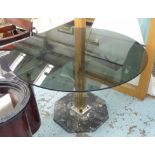 ROMEO REGA CENTRE TABLE, circular, with smoky glass top on a brass and chrome base,