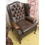 WINGBACK ARMCHAIR, buttoned brown leather, 83cm W x 112cm H x 73cm D.