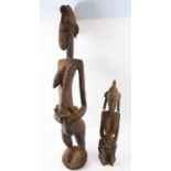TWO SENUFO MATERNITY FIGURES, carved wood, 92cm H and 54cm H.