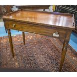 WRITING TABLE, George IV mahogany with shallow 3/4 gallery and full width frieze drawer,