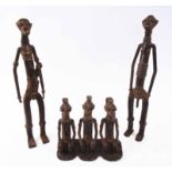 LOBI BRONZE FIGURAL SCULPTURES, seated chief and wives, plus Burika Faso standing male and female,