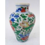 ORIENTAL CERAMIC VASE, with all over design of dragons amidst foliage, 19cm H.