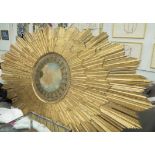 ITALIAN SCHOOL, mid 18th century ceiling boss, sunburst giltwood frame,