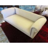 WINDOW SEAT, with beige upholstery on short turned supports, 137cm W x 65cm H x 55cm D.