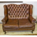 WING SOFA, Queen Anne style in close nailed buttoned brown leather, with two seat cushions,