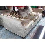 ANDREW MARTIN SOFA, three seater, with shimmering velvet upholstery and loose scatter cushions,