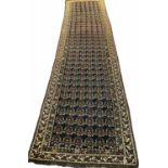 ANTIQUE NORTH-WEST PERSIAN RUNNER, 374cm x 93cm,