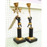 GILDED BLACKAMOOR CANDLE HOLDERS, a pair, in part gilded metal, 32cm H.