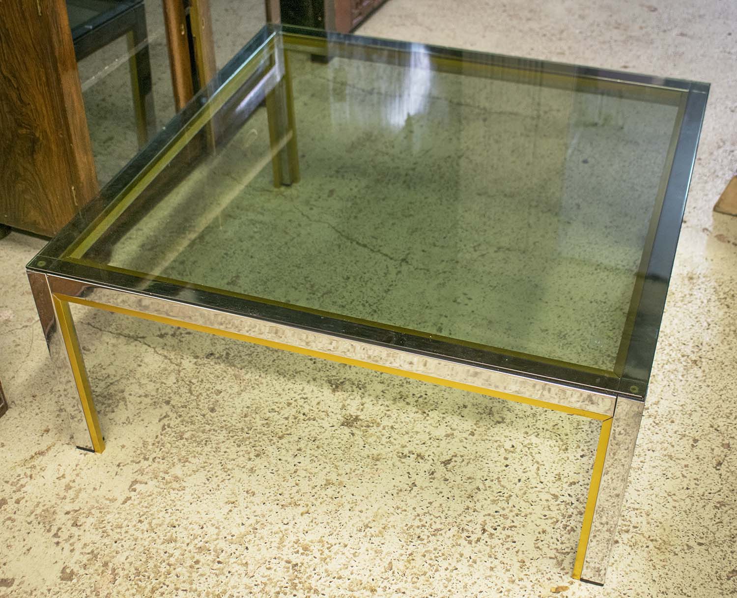 WILLY RIZZO INSPIRED LOW TABLE, 1970's, chrome and brass with square tinted glass top,