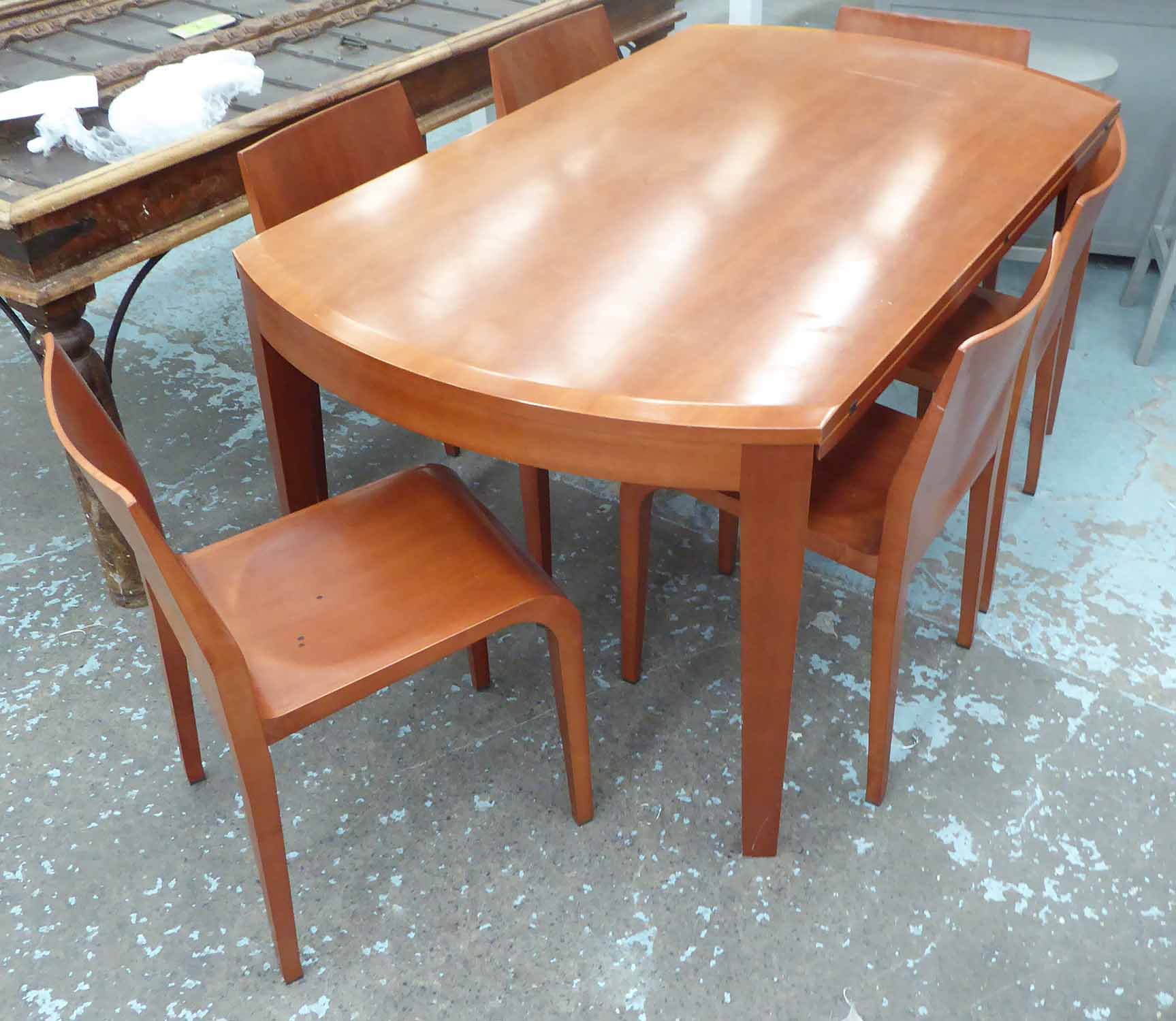 CONTEMPORARY DINING SET, dining table with drop leaf in fruitwood on shaped supports,