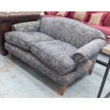 RECLINE & SPRAWL SOFA, two seater, floral pattern on a blue ground, 140cm L.