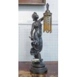 TABLE LAMP, of figural form, a maiden holding aloft a light, signed Villanio, 56cm H.