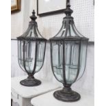 VINTAGE STYLE STORM LANTERNS, a pair, in a metal surround, 71cm H.