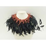 A BESPOKE MADE CORAL AND OSTRICH FEATHER COUTURE NECKLACE.