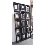 JOHN RICHARD MIRROR, consisting of fifteen smaller mirrors in an ebonised frame, 200cm x 100cm,