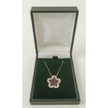 18K ROSE GOLD RUBY AND DIAMOND PENDANT NECKLACE, in the form of a clover leaf.