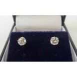 PAIR OF 14K WHITE GOLD DIAMOND STUD EARRINGS, approx 85 points.