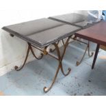 JOHN RICHARD SIDE TABLES, a pair, with black marble tops on gilded metal cross framed support,