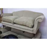 'RECLINE AND SPRAWL' SOFA, Georgian style with arched back, scroll arms,