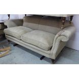 'RECLINE AND SPRAWL' SOFA, Georgian style with arched back, scroll arms,