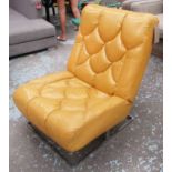 RETRO EASY CHAIR, mustard padded upholstery on polished supports, 70cm x 86cm H.