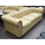 CHESTERFIELD SOFA, contemporary, cream leather buttoned and studded castors,