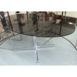 DINING TABLE, Merrow Associates style, smoked glass top on polished metal base,