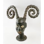 EKOI FEMALE HEAD MASK, a companion pair to lot 533 with two projecting hair coils,