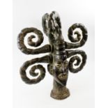 EKOI MALE HEAD MASK, Nigeria/Cameroon, leather clad carved wood with six projecting hair coils,