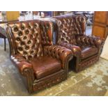 WING ARMCHAIRS, a pair, in buttoned burgundy leather with cushion seats, 93cm W.