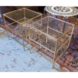 LOW OCCASIONAL TABLES, a pair, gilt metal framed, three tier, each with a square glass top,
