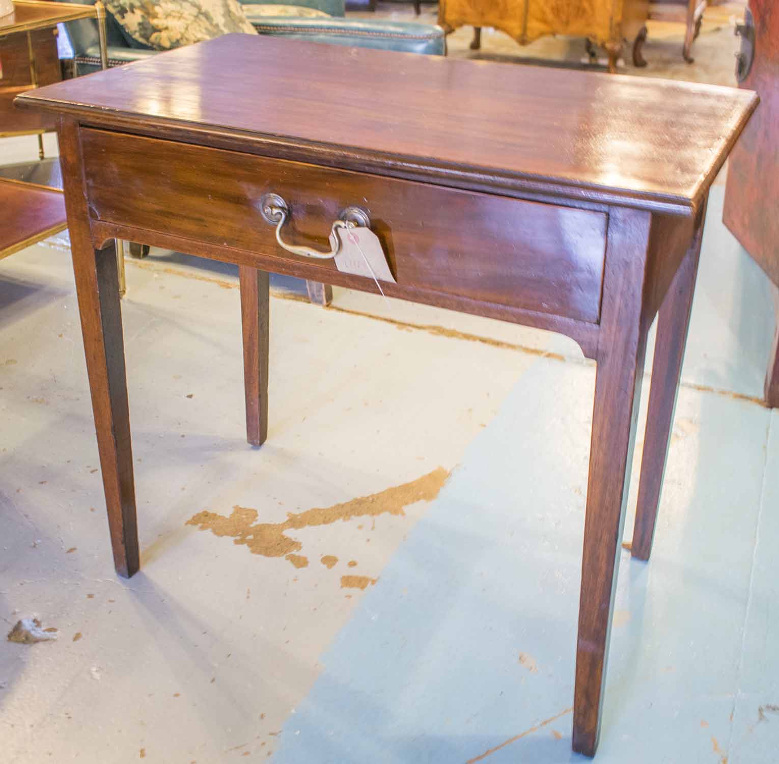 WRITING TABLE, George III figured mahogany and line inlaid with full width frieze drawer,
