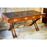 CAMPAIGN STYLE TRESTLE DESK, mahogany and brass bound with three frieze drawers,