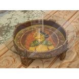 INDIAN LOW TABLE, painted wood with later circular glass top, 91.5cm diam x 27cm H.